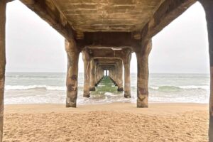 Underneath the iconic Manhattan Beach pier